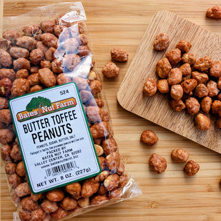 Bag of Butter Toffee Peanuts with a label on a wooden surface